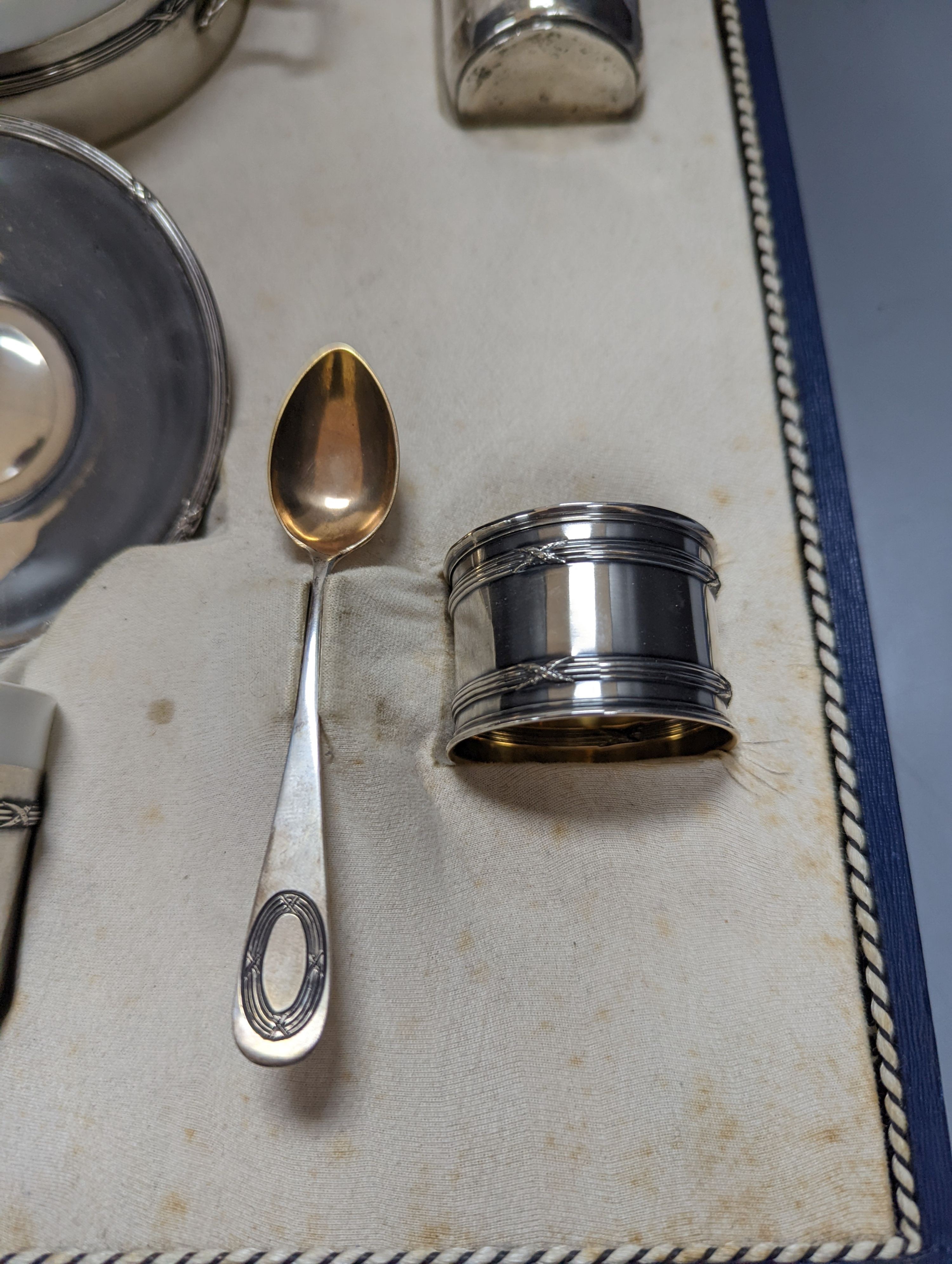 A cased part German 800 white metal mounted ceramic part tea set (incomplete), metal weight 5.5oz.